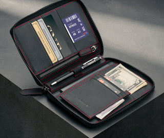Inside of the Black Leather with Red Stitching Solo Travel Wallet showing multiple cards, boarding pass, passport and money