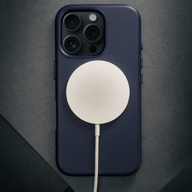MagSafe charger attached to the Blue Leather Slimline Bumper Case for iPhone 16 Pro Max