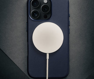 MagSafe charger attached to the Blue Leather Slimline Bumper Case for iPhone 16 Pro Max