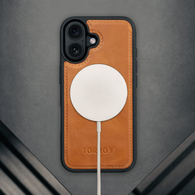 MagSafe charger attached to the Black Leather Detachable Case for iPhone 17