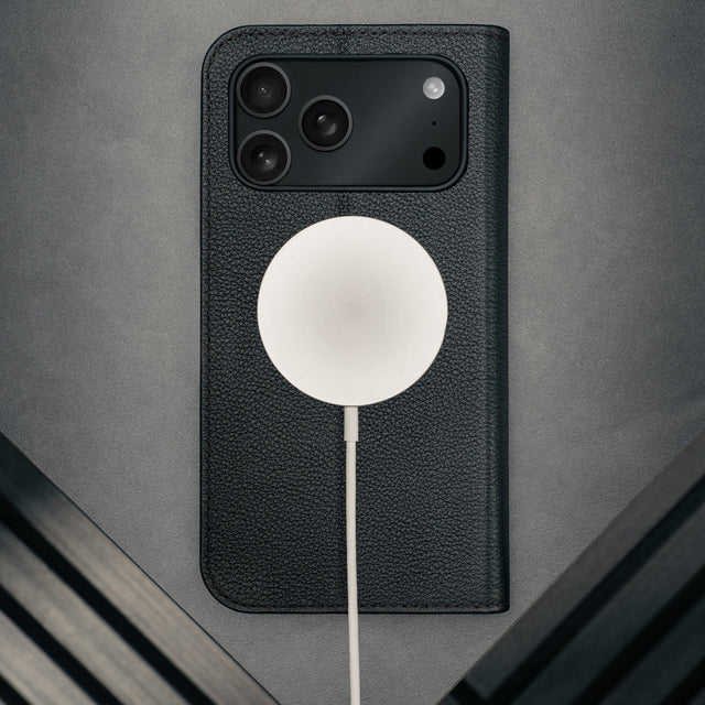 MagSafe charger attached to the Black Leather Case for iPhone 17 Pro