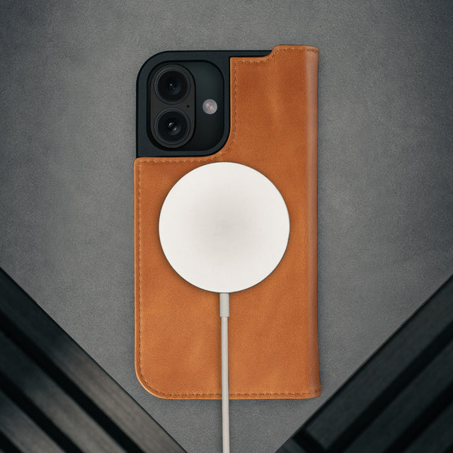 MagSafe charger attached to the Tan Leather Case for iPhone 17