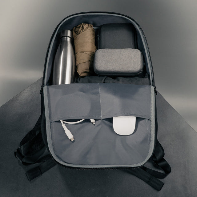 Items inside the main compartment and internal pockets of the Black Commuter Backpack