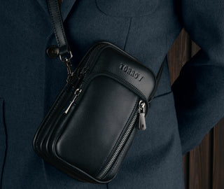 Black Leather Phone Bag worn over a model's shoulder