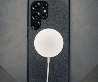 MagSafe charger attached to the Black Slimline Leather Bumper Case for Galaxy S25 Ultra