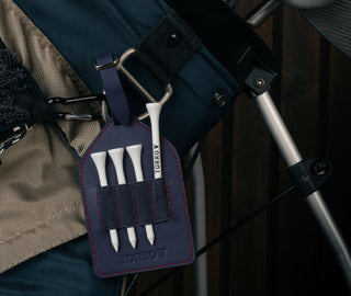Navy Blue Leather Golf Tee Holder attached to golf bag