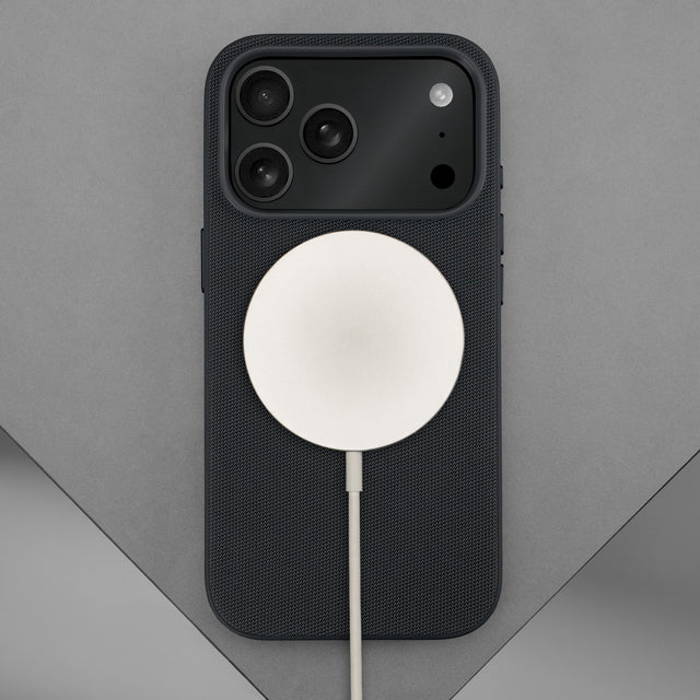 Wireless charger attached to the Black Woven Fabric Bumper Case for iPhone 17 Pro Max