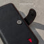 Close up of the magnetic clasp closure on the Black Leather (with Red Stitching) Wallet Case for iPhone 11