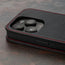 Camera cutout on the Black with Red Detail Leather Flip Case for iPhone 15 Pro
