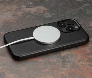 MagSafe Charger attached to the Black Slimline Leather Bumper Case for iPhone 15 Pro Max